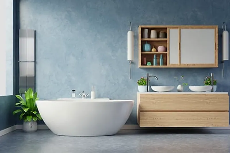 Finished bathroom remodel with freestanding tub, wood vanity and tile flooring in a Washington home