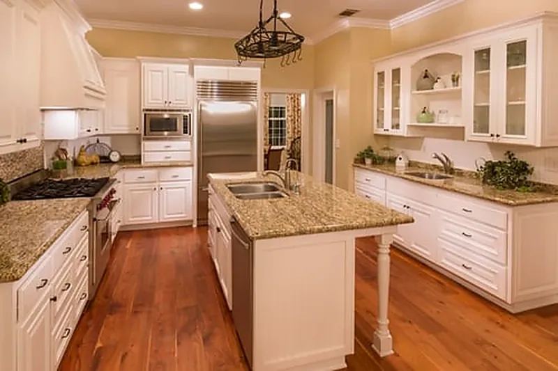 Completed kitchen remodel with custom cabinetry, stone counters and hardwood flooring in Washington